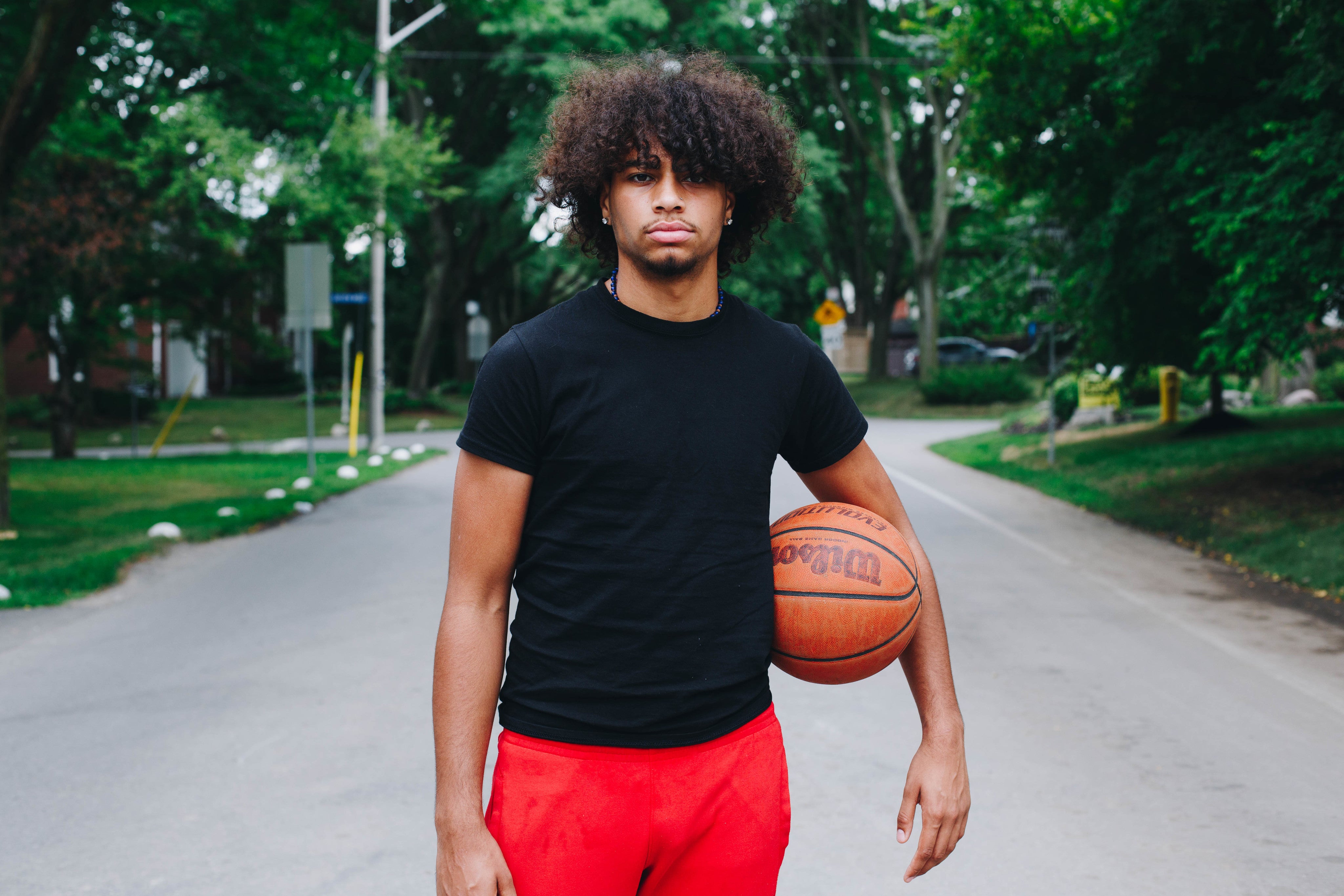 files/man-stands-with-his-basketball.jpg